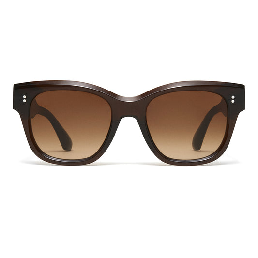A pair of chunky cat-eye sunglasses with a dark brown translucent acetate frame and matching brown gradient lenses, shown against a plain white background.